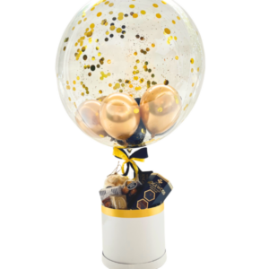 Balloon with gold confetti and treats